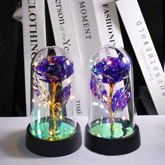 Rosa artificial luminosa decorativa en cúpula de plástico