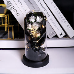 Rosa artificial luminosa decorativa en cúpula de plástico