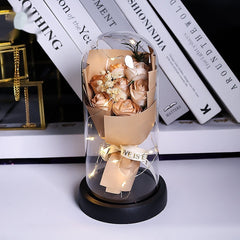 Rosa artificial luminosa decorativa en cúpula de plástico