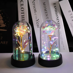 Rosa artificial luminosa decorativa en cúpula de plástico