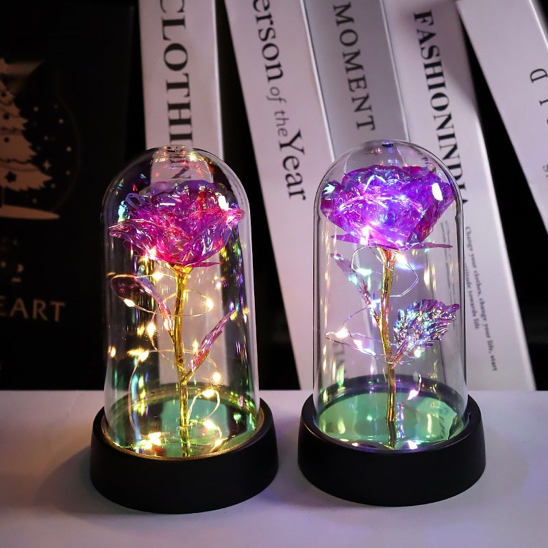 Rosa artificial luminosa decorativa en cúpula de plástico